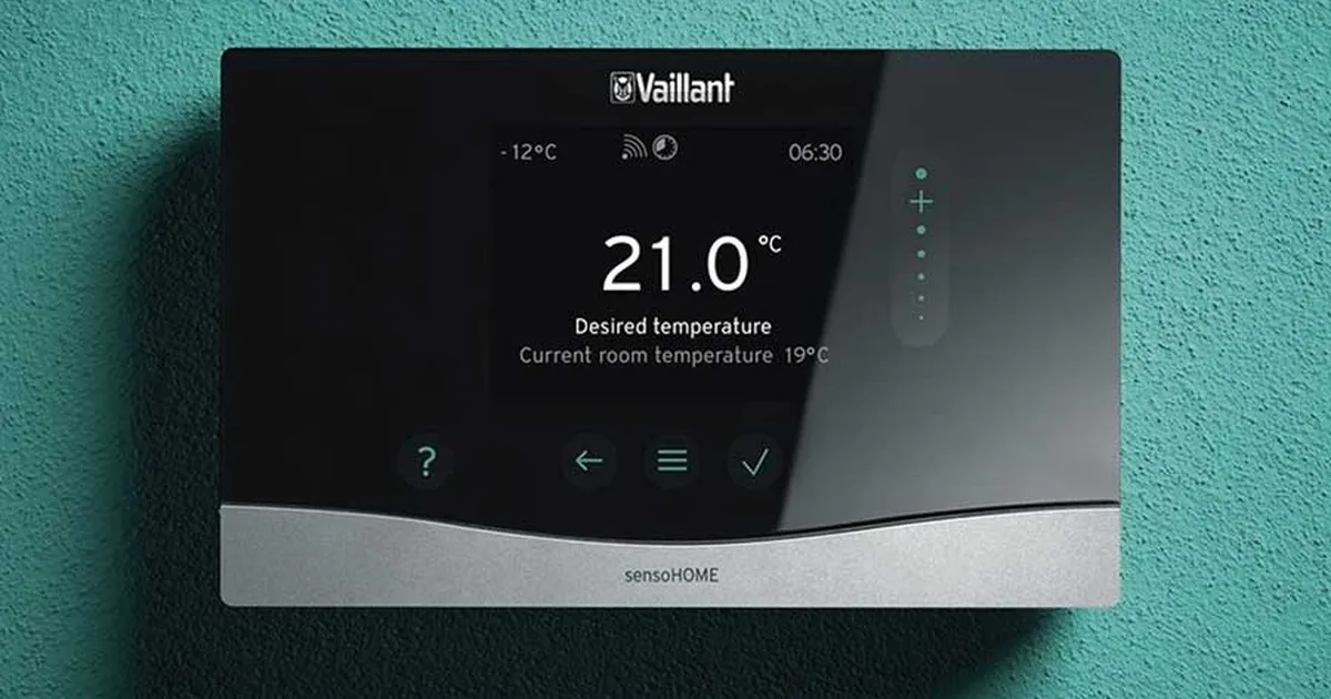 Vaillant sensoHOME smart thermostat showing 21°C desired temp, installed on a teal wall in Edinburgh.